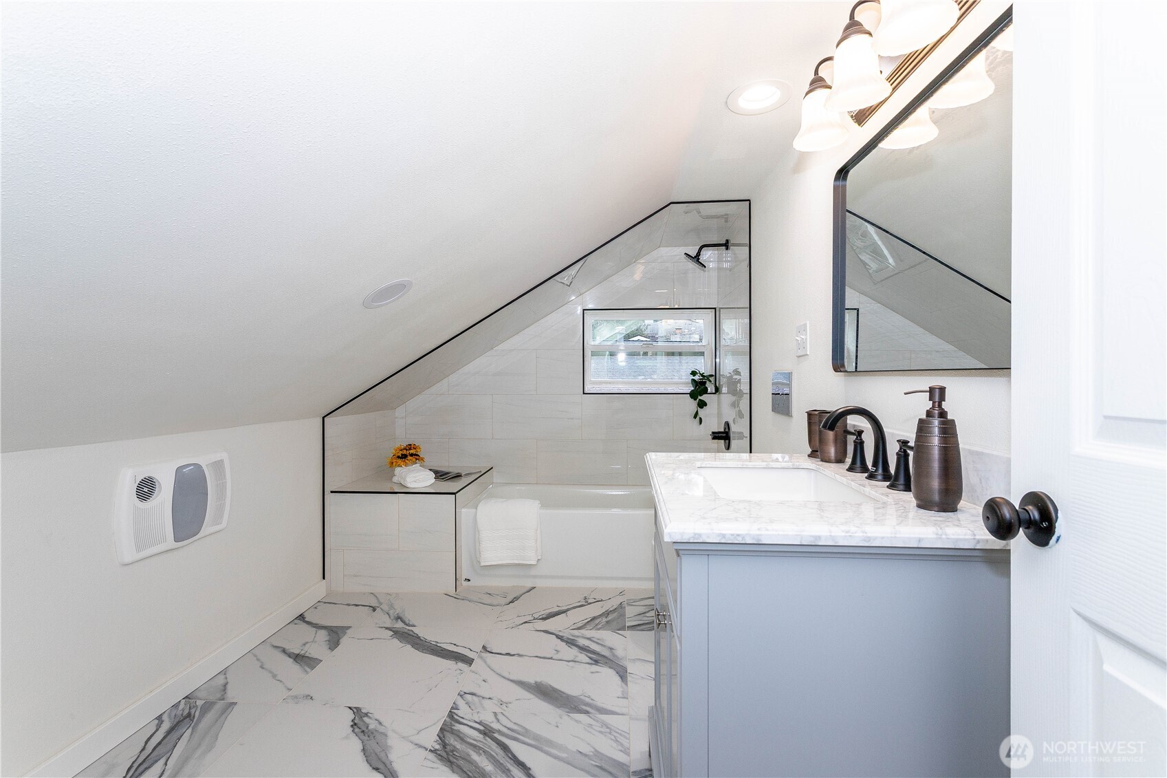 2644 Southwest 112th Street Seattle, WA 98146 - Photo 16 of 33 a bathroom with a sink vanity and mirror