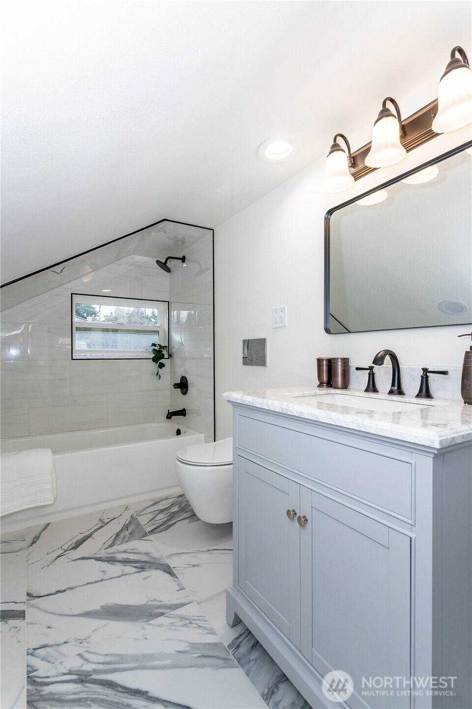 2644 Southwest 112th Street Seattle, WA 98146 - Photo 17 of 33 a bathroom with a sink and mirror