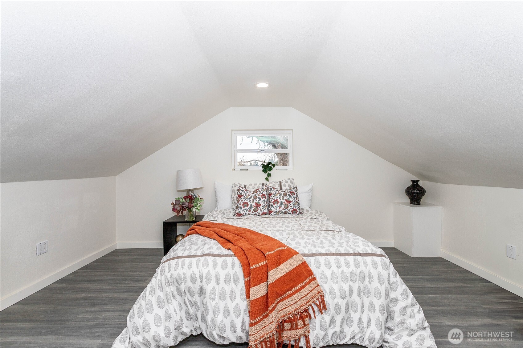 2644 Southwest 112th Street Seattle, WA 98146 - Photo 19 of 33 a bed sitting in a bedroom next to a window
