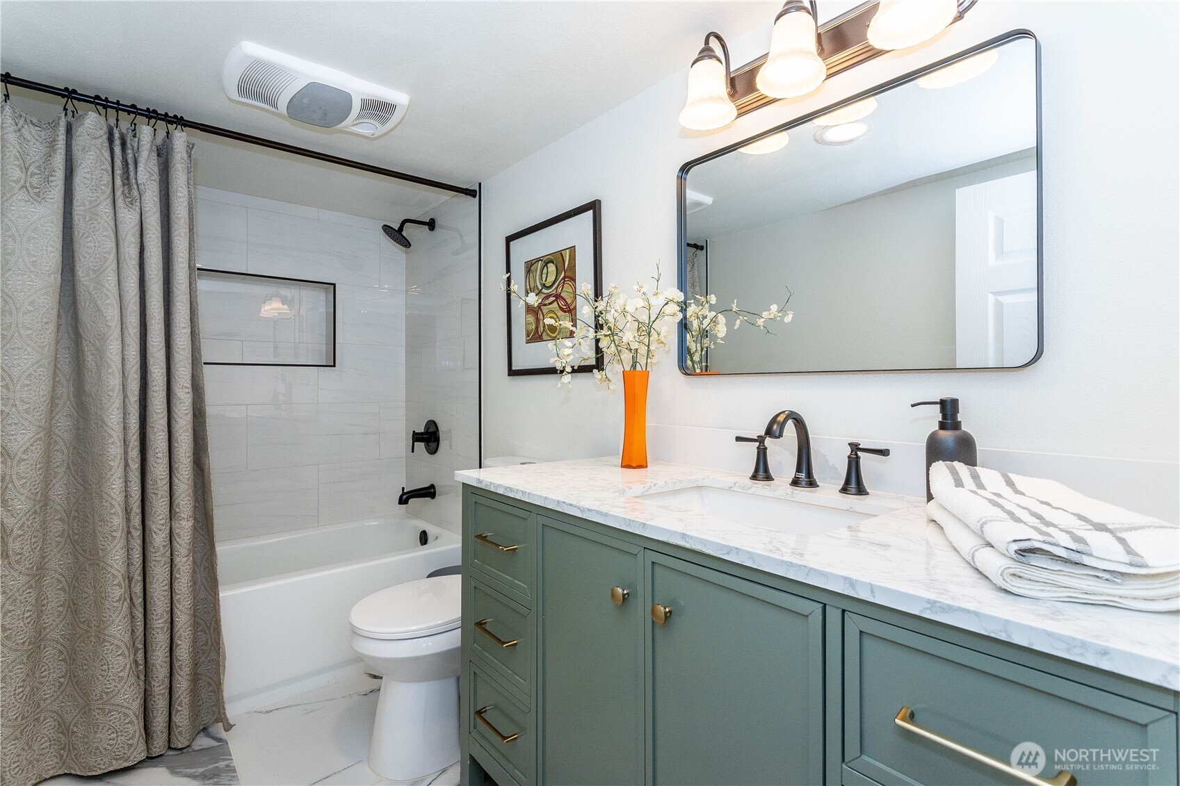 2644 Southwest 112th Street Seattle, WA 98146 - Photo 26 of 33 a bathroom with a granite countertop sink mirror vanity bathtub and a toilet