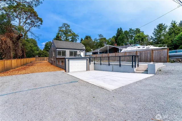a view of house with outdoor space and sitting area