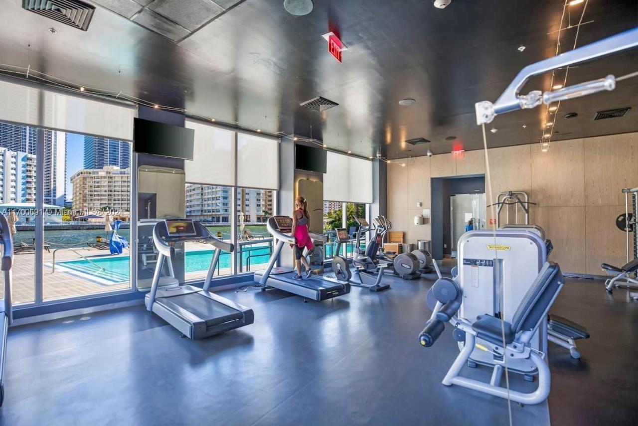 2602 East Hallandale Beach Boulevard, Unit R508 Hallandale Beach, FL 33009 - Photo 23 of 43 a view of a room with gym equipment