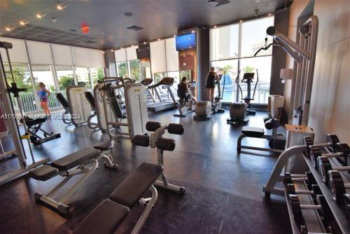 2602 East Hallandale Beach Boulevard, Unit R508 Hallandale Beach, FL 33009 - Photo 24 of 43 a view of a room with gym equipment