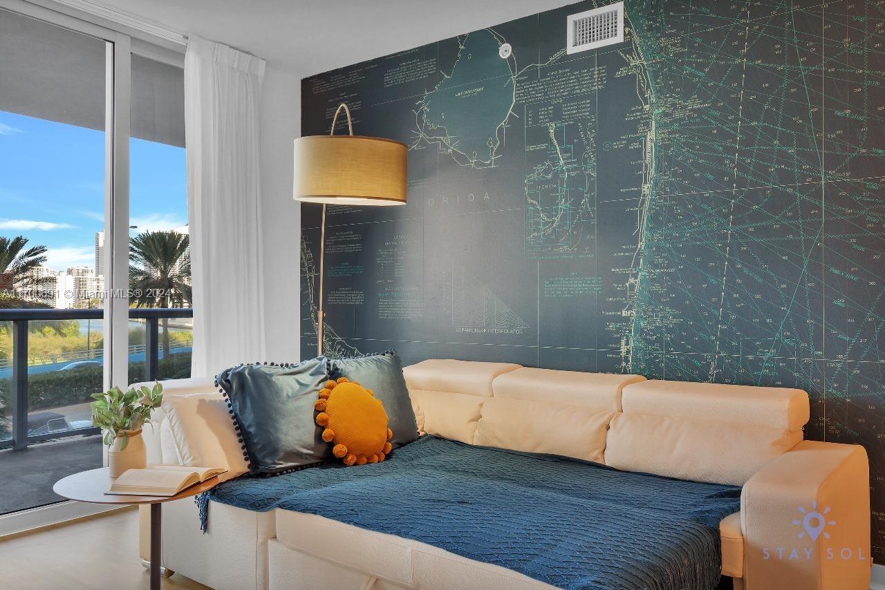 2602 East Hallandale Beach Boulevard, Unit R508 Hallandale Beach, FL 33009 - Photo 35 of 43 a bedroom with a bed and balcony view