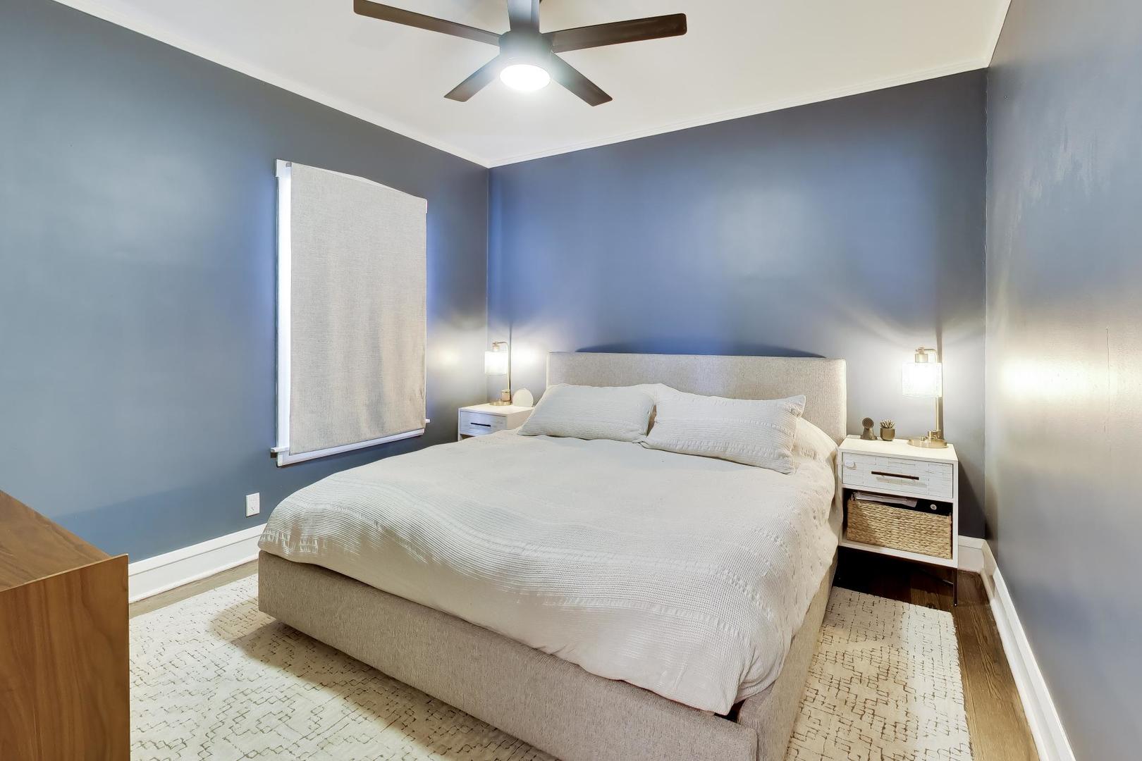 6101 West Patterson Avenue Chicago, IL 60634 - Photo 13 of 40 a bedroom with a bed and a lamp