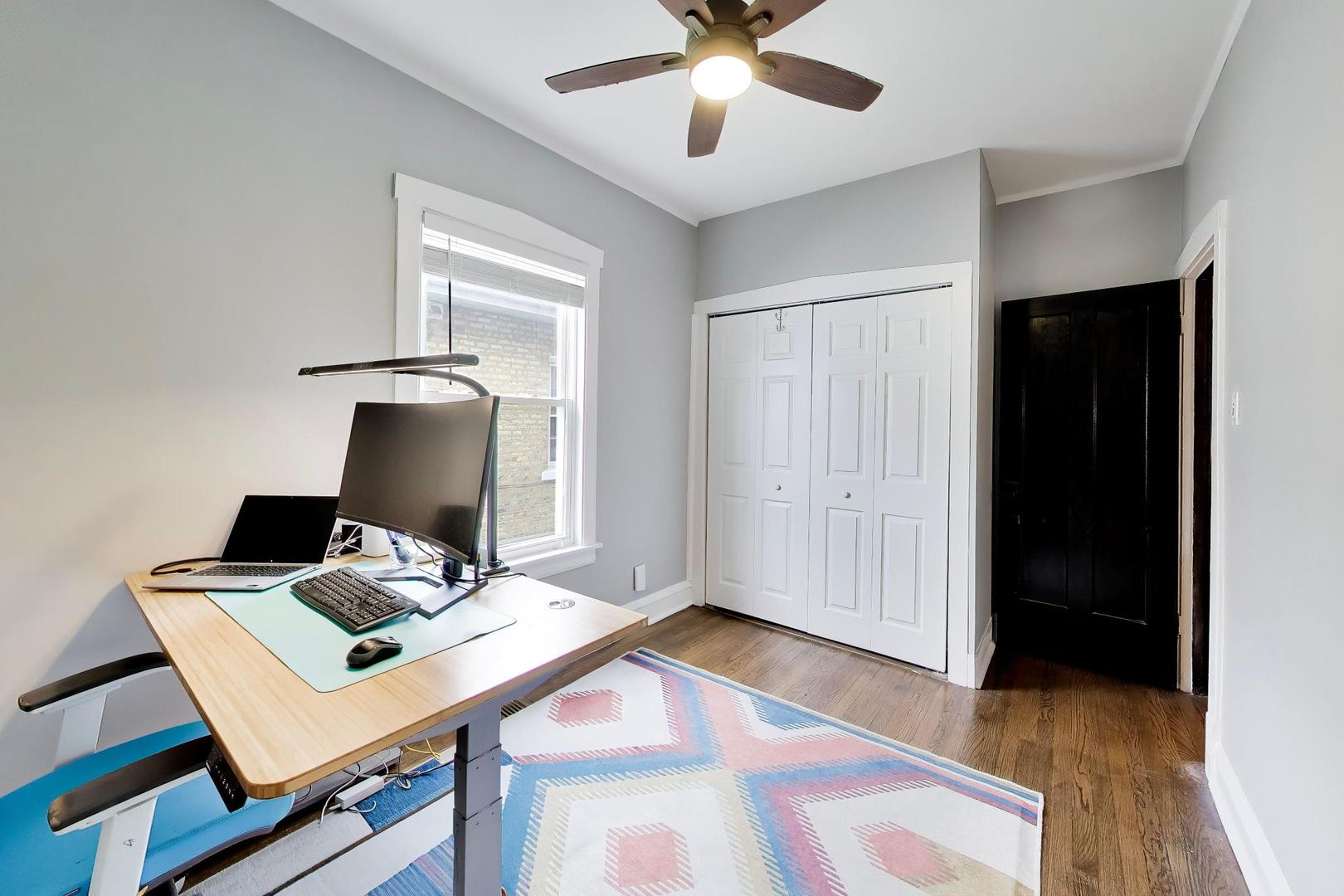 6101 West Patterson Avenue Chicago, IL 60634 - Photo 16 of 40 a work room with furniture and wooden floor