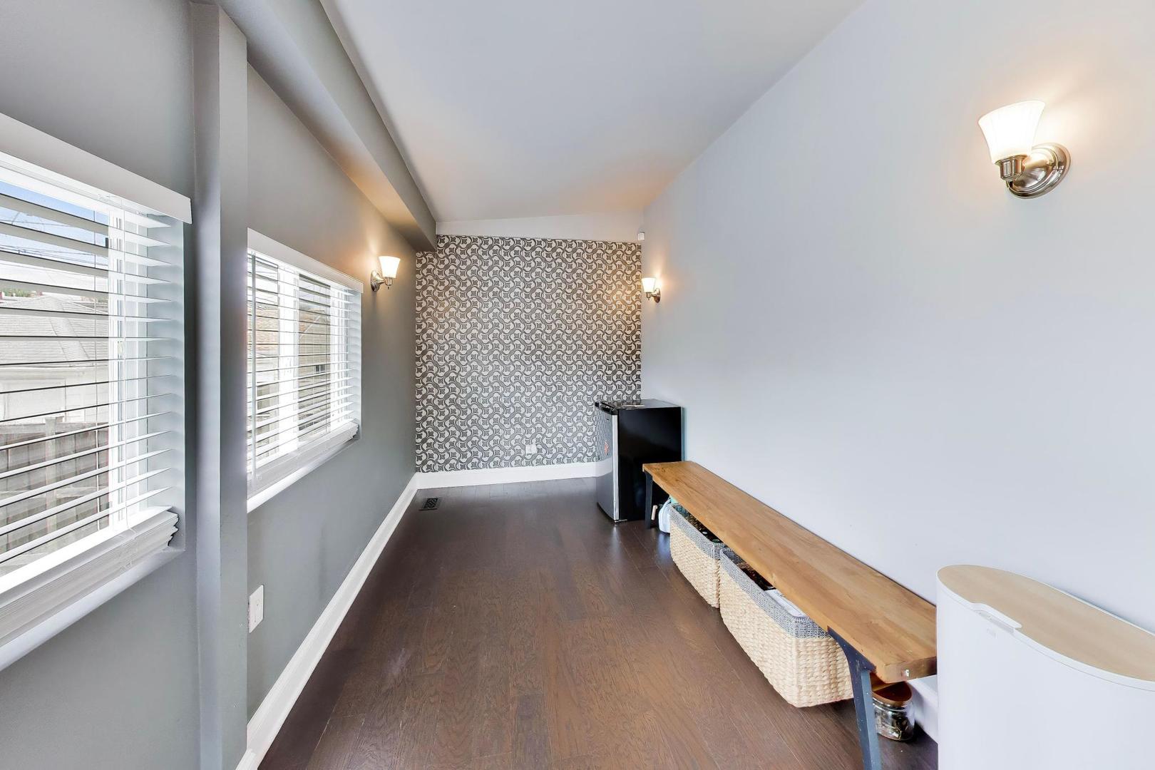 6101 West Patterson Avenue Chicago, IL 60634 - Photo 18 of 40 a view of hallway with wooden floor and chandelier