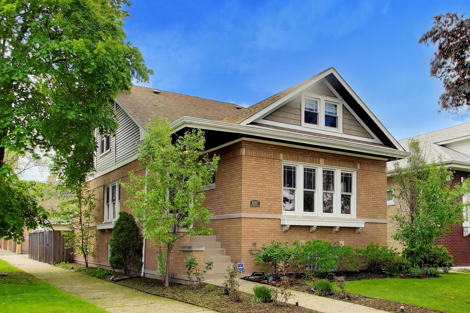6101 West Patterson Avenue Chicago, IL 60634 - Photo 2 of 40 a front view of a house with a yard