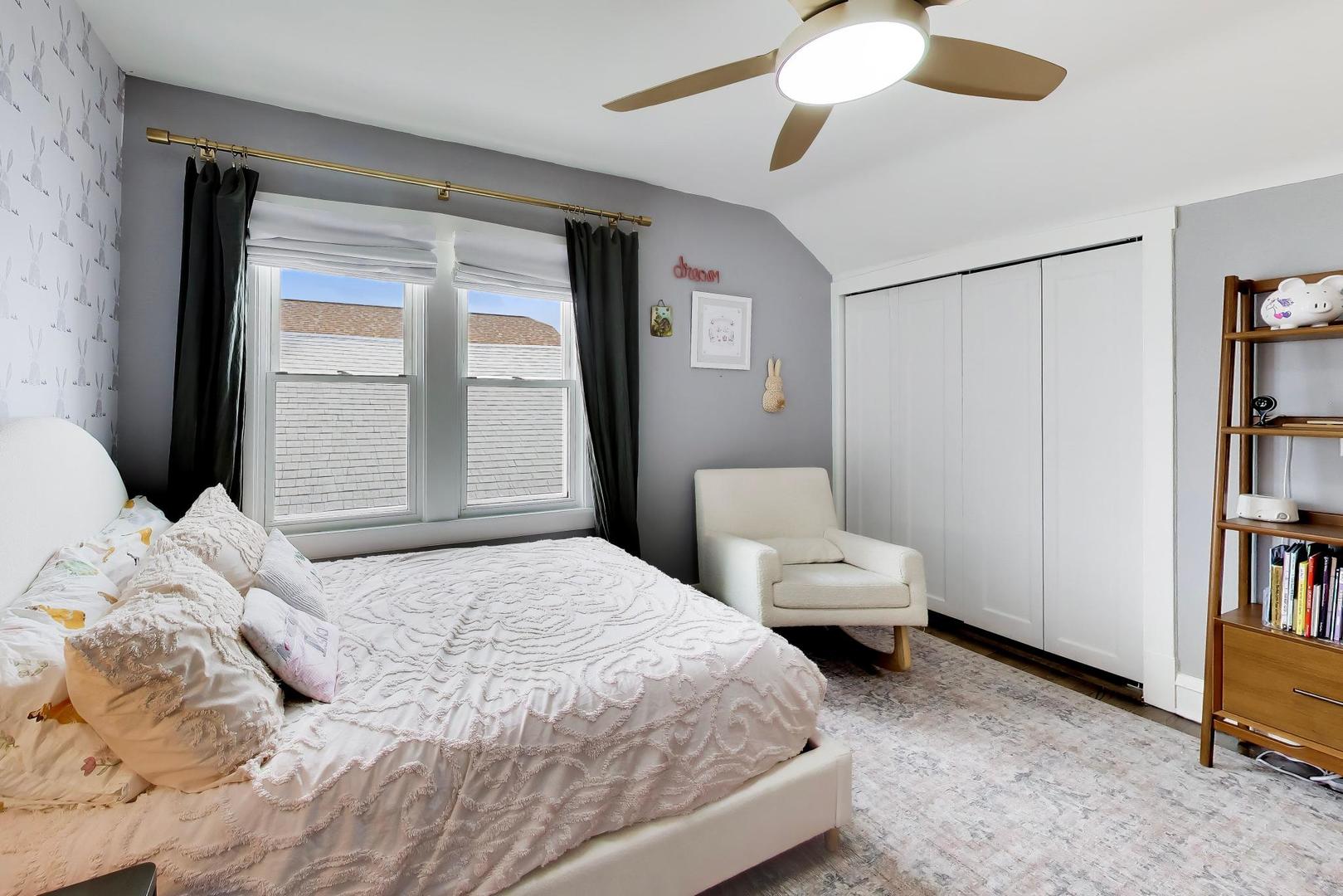 6101 West Patterson Avenue Chicago, IL 60634 - Photo 23 of 40 a bedroom with a bed and a book shelf