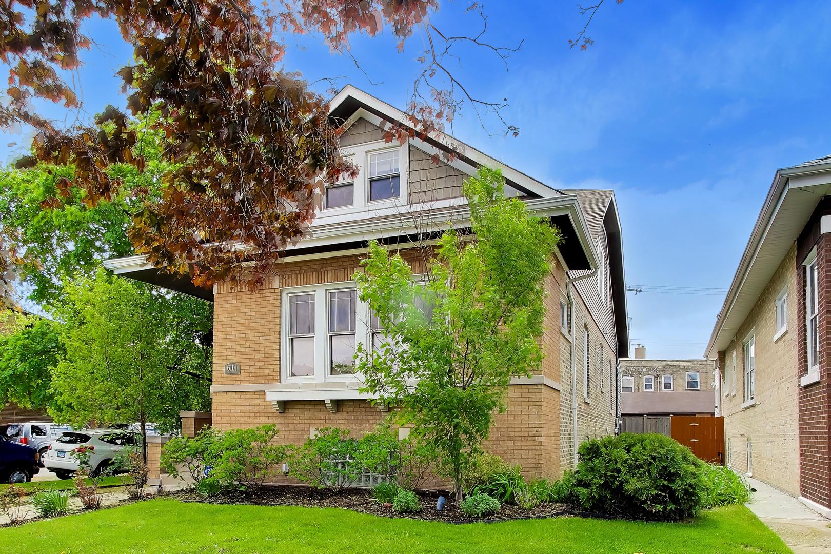6101 West Patterson Avenue Chicago, IL 60634 - Photo 3 of 40 a front view of a house with a yard