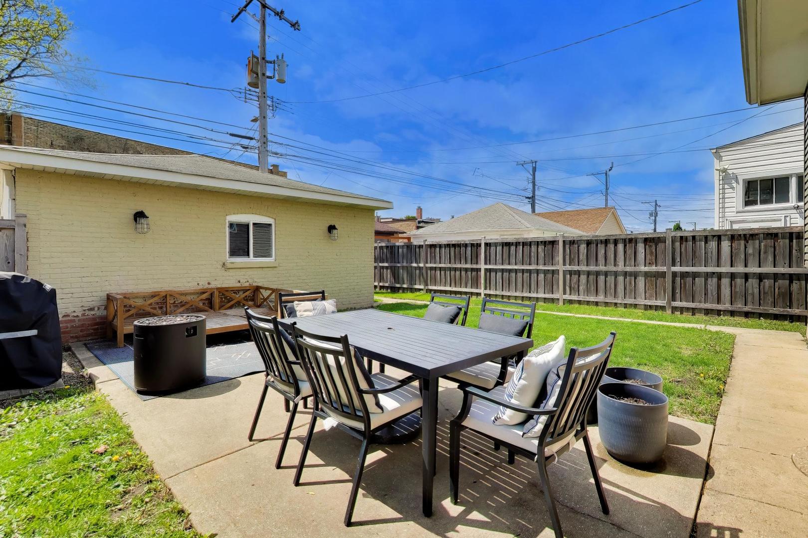 6101 West Patterson Avenue Chicago, IL 60634 - Photo 37 of 40 a view of a dinning table and chairs in patio