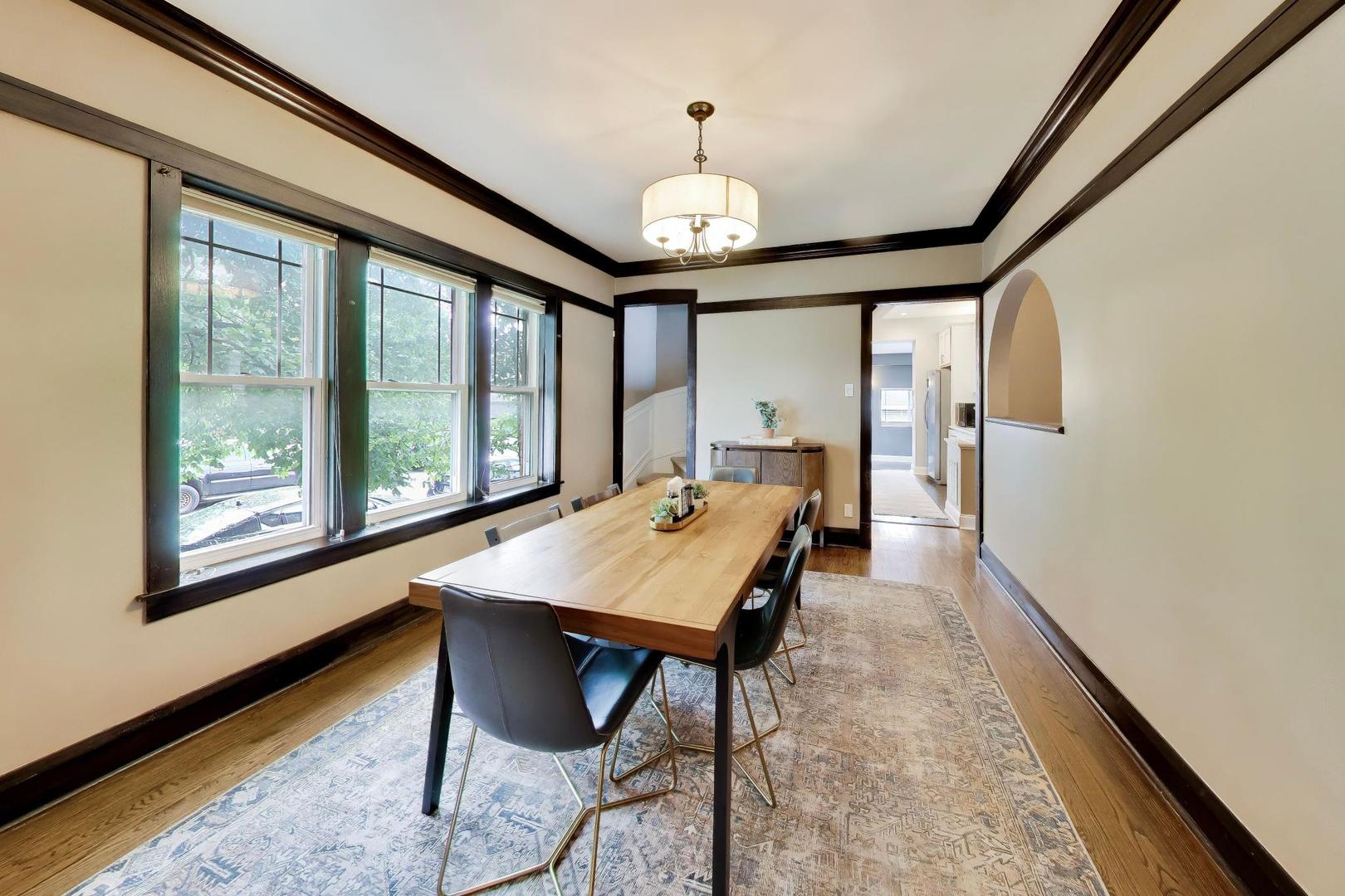 6101 West Patterson Avenue Chicago, IL 60634 - Photo 8 of 40 a view of a dining room with furniture window and wooden floor