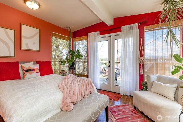 a bedroom with a bed and a couch