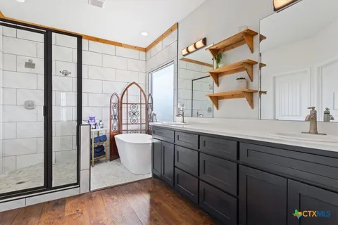 a bathroom with a shower and a sink