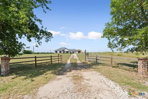 a view of a yard with an outdoor space