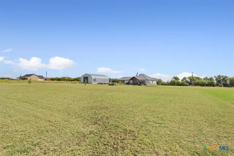a view of a table and chairs in the patio