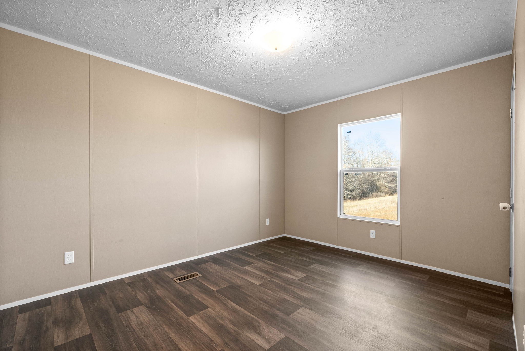 842 Pleasant Greenhill Road Crofton, KY 42217 - Photo 20 of 29 an empty room with wooden floor and windows