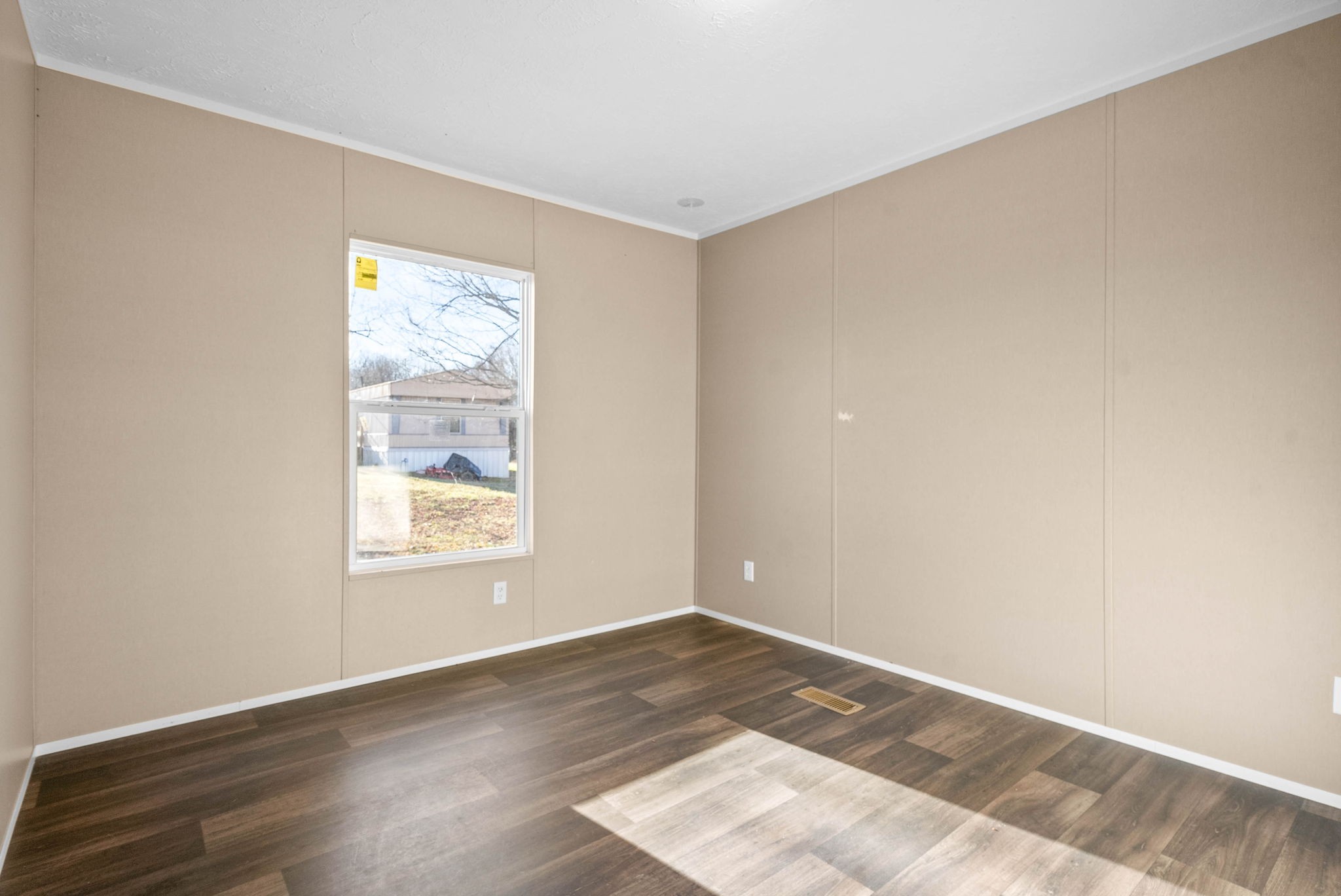 842 Pleasant Greenhill Road Crofton, KY 42217 - Photo 23 of 29 an empty room with wooden floor and windows