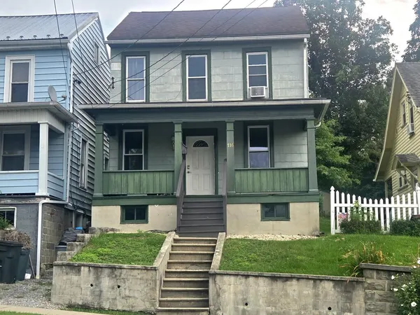 a front view of a house with a porch