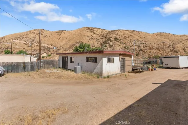 a view of a house with a snow in the background