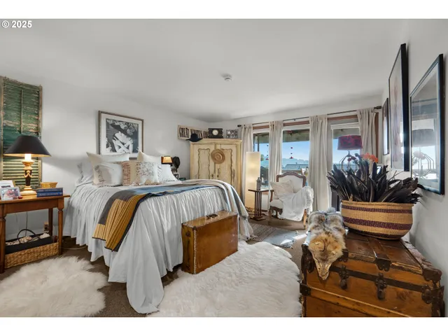 a bed room with a bed and a chair