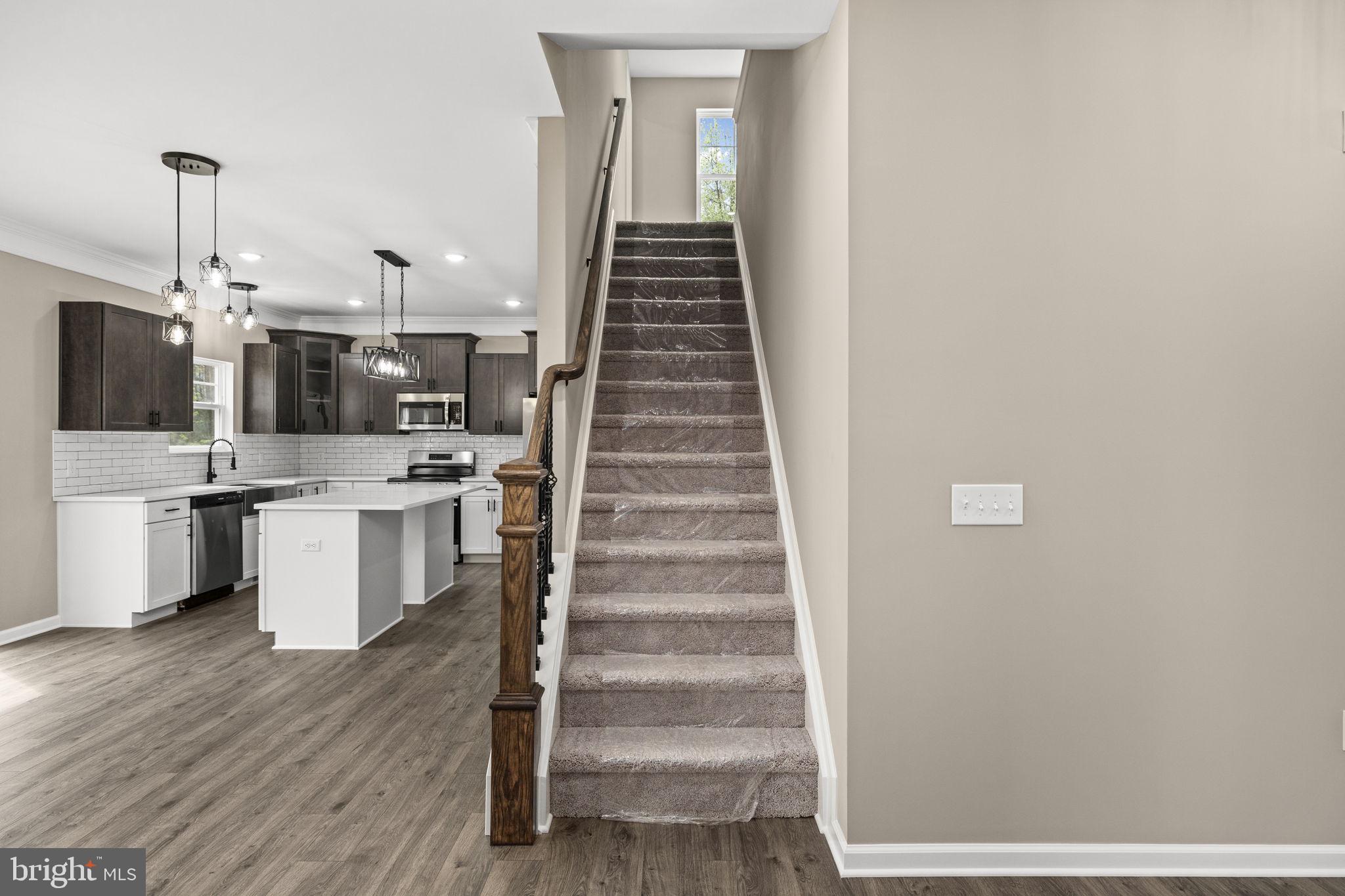 12413 Toll House Road Spotsylvania, VA 22551 - Photo 11 of 68 a view of a kitchen with cabinets and wooden floor