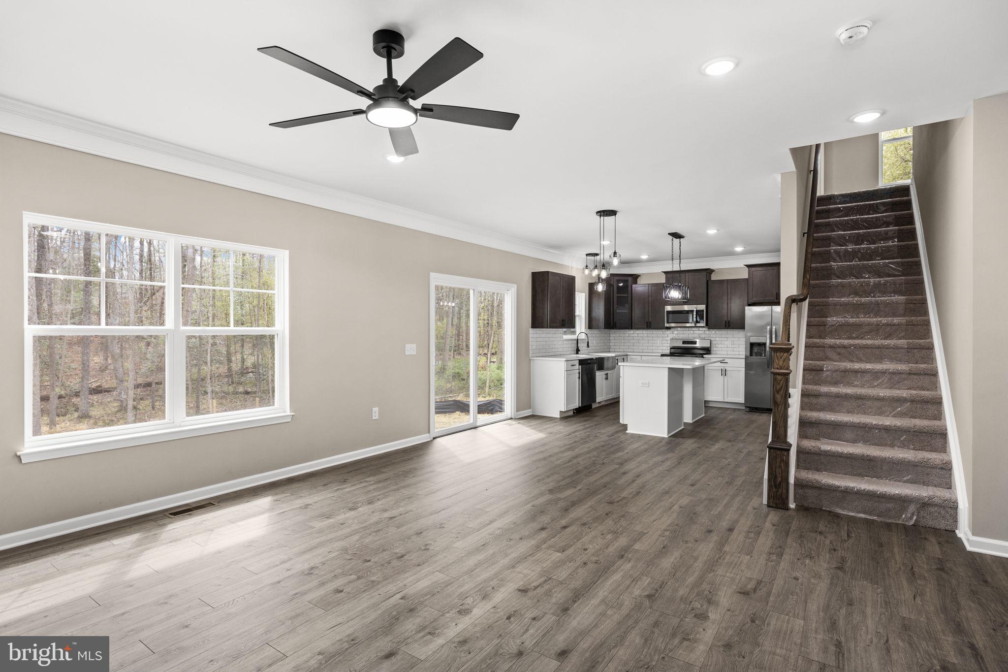 12413 Toll House Road Spotsylvania, VA 22551 - Photo 18 of 68 a view of a kitchen with furniture and wooden floor