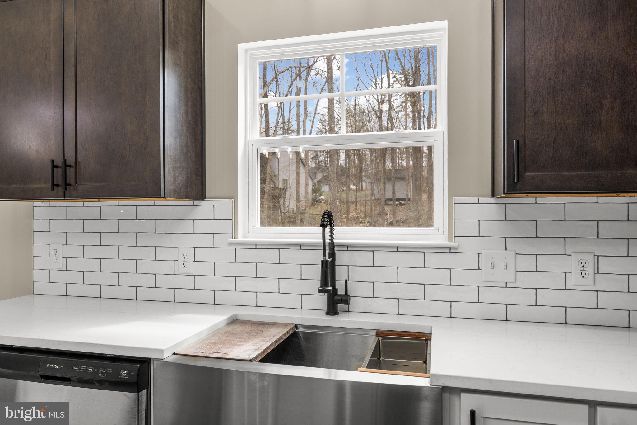 12413 Toll House Road Spotsylvania, VA 22551 - Photo 26 of 68 a kitchen with a sink and a window