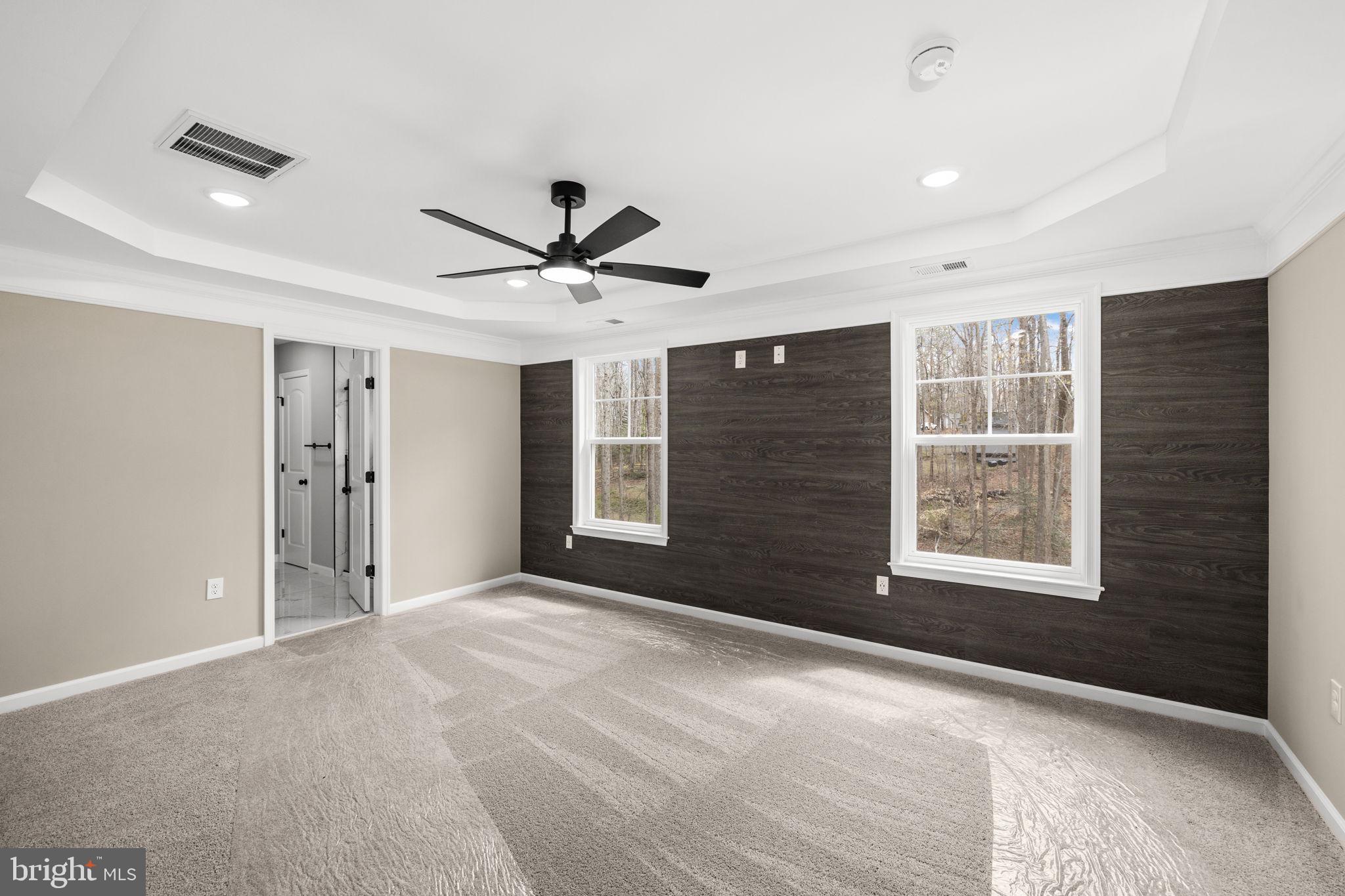 12413 Toll House Road Spotsylvania, VA 22551 - Photo 32 of 68 a view of a livingroom with a ceiling fan and windows