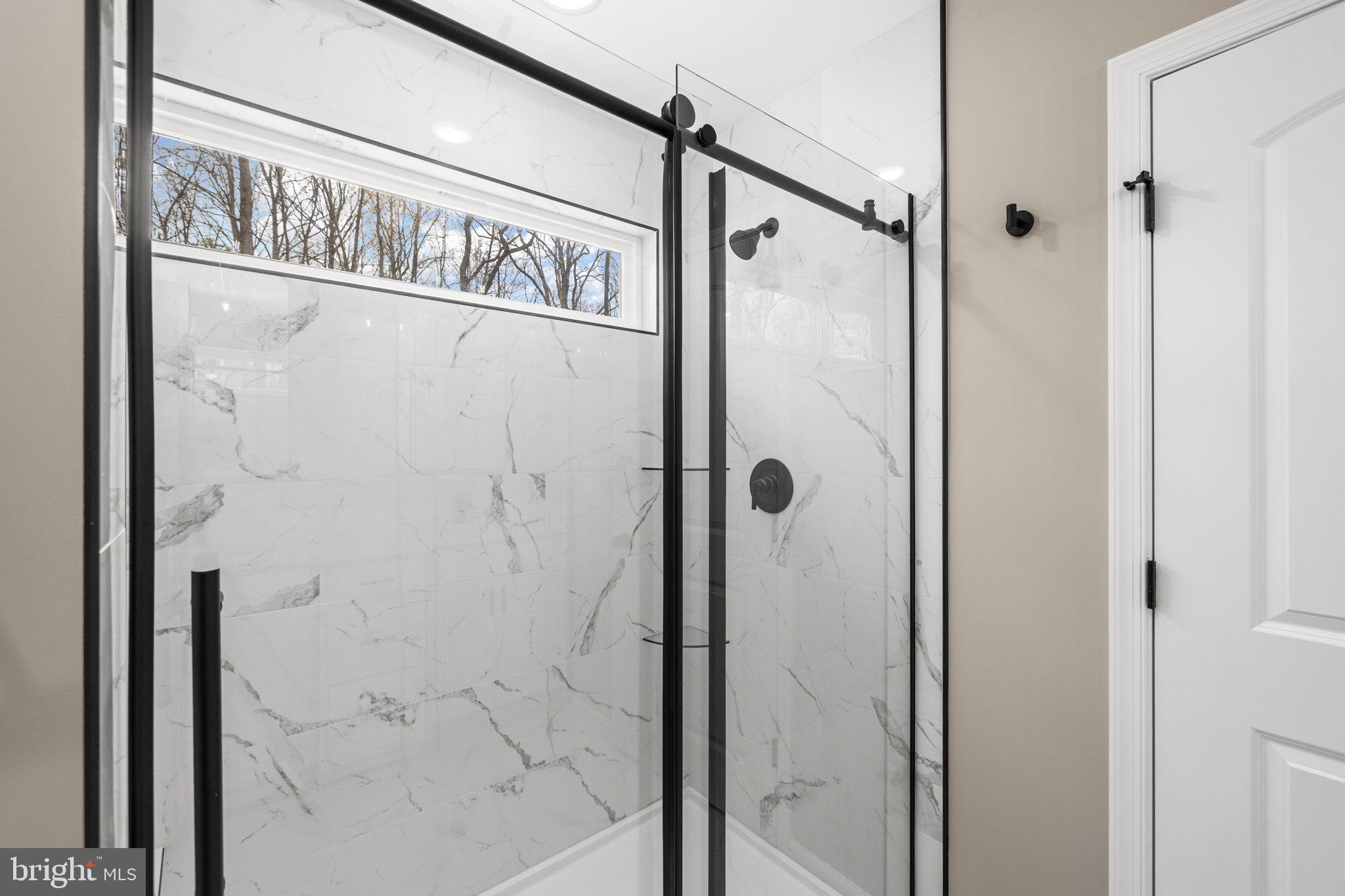 12413 Toll House Road Spotsylvania, VA 22551 - Photo 35 of 68 a bathroom with a glass door shower