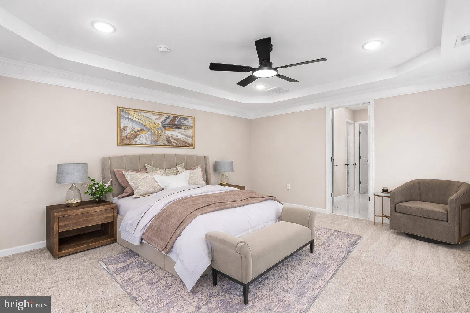 12413 Toll House Road Spotsylvania, VA 22551 - Photo 4 of 68 a spacious bedroom with a bed and a couch