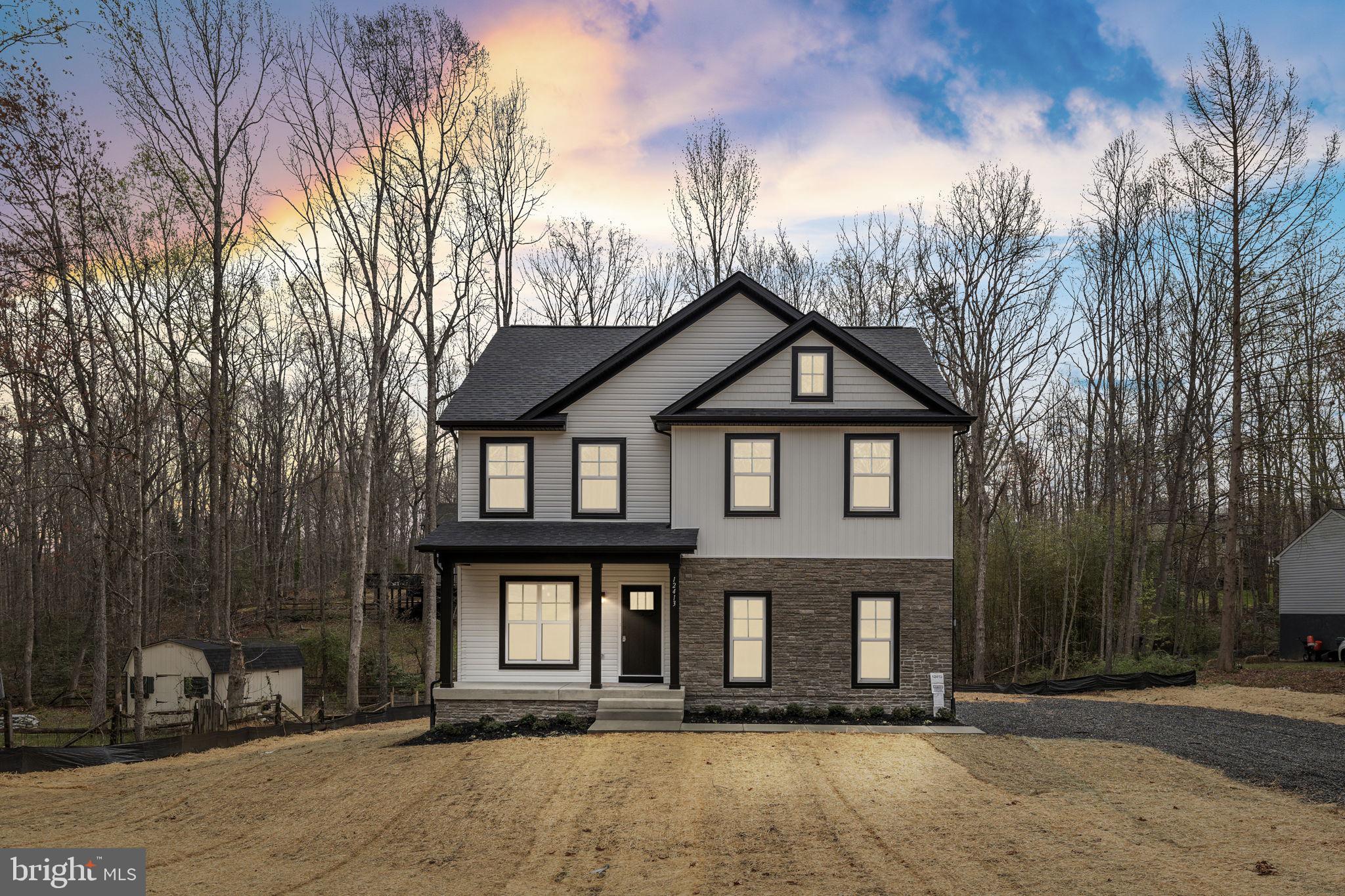 12413 Toll House Road Spotsylvania, VA 22551 - Photo 45 of 68 a front view of a house with a yard