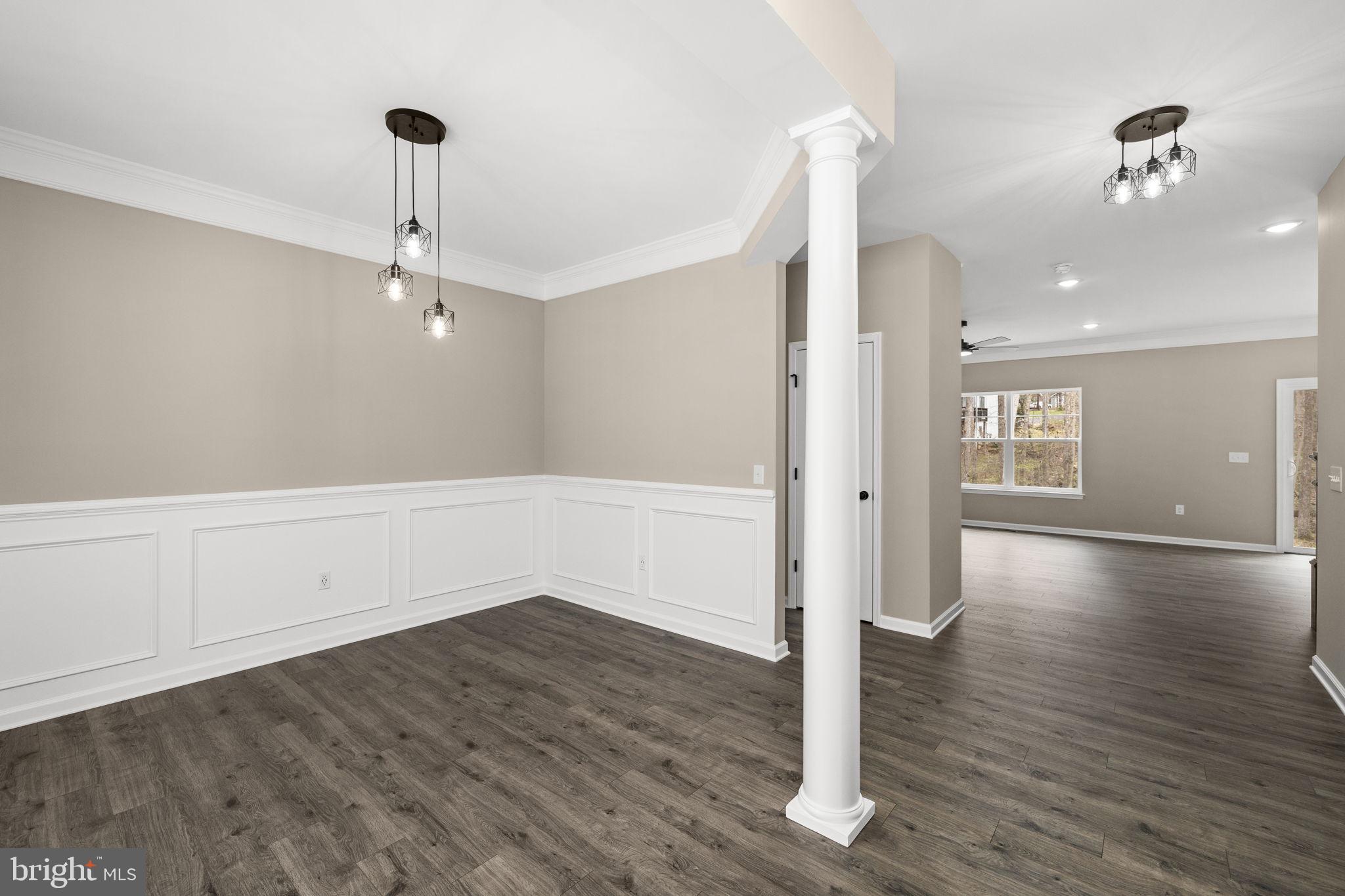 12413 Toll House Road Spotsylvania, VA 22551 - Photo 9 of 68 a view of an empty room with wooden floor