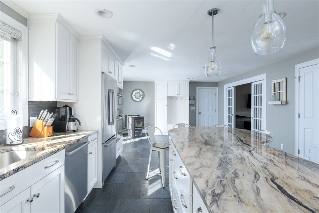 27 Vista Circle Rutland, MA 01543 - Photo 5 of 35 a large kitchen with stainless steel appliances granite countertop a lot of counter space and wooden floor