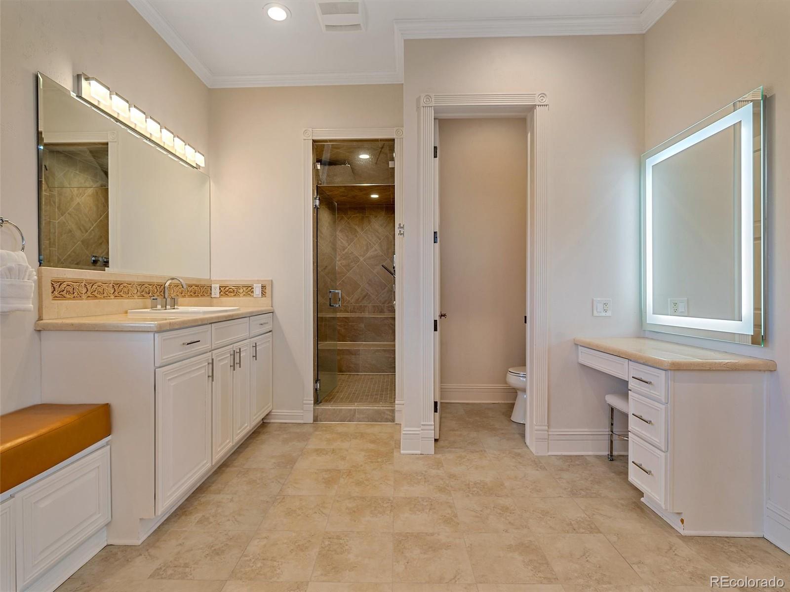 4213 Nambe Road Indian Hills, CO 80454 - Photo 27 of 49 a bathroom with a sink and a mirror