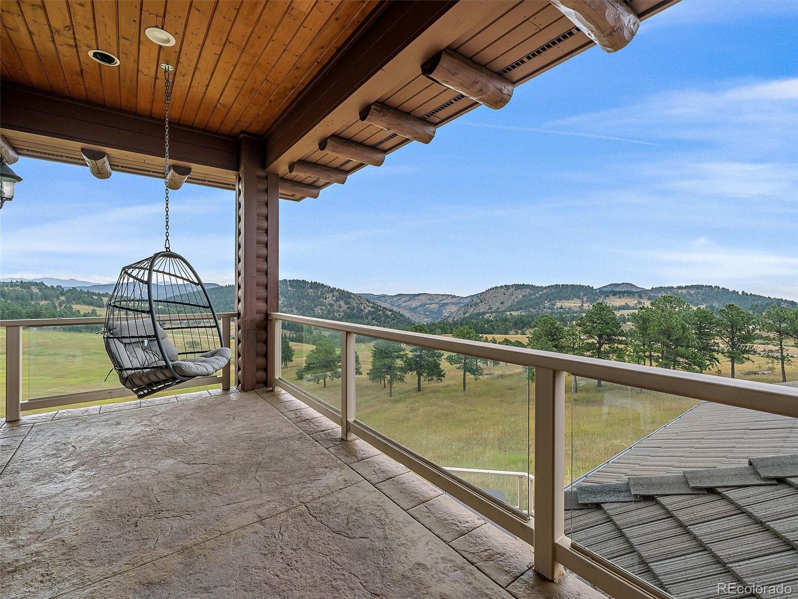 4213 Nambe Road Indian Hills, CO 80454 - Photo 28 of 49 a view of sitting space in front of a house