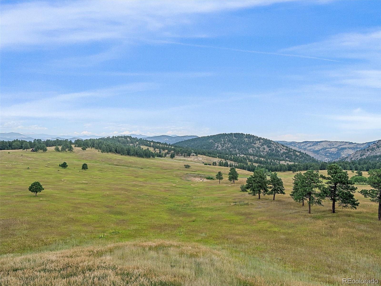 4213 Nambe Road Indian Hills, CO 80454 - Photo 29 of 49 a view of an ocean from a mountain