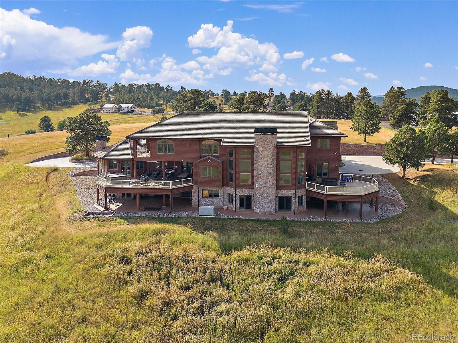 4213 Nambe Road Indian Hills, CO 80454 - Photo 3 of 49 a view of a swimming pool with lake view