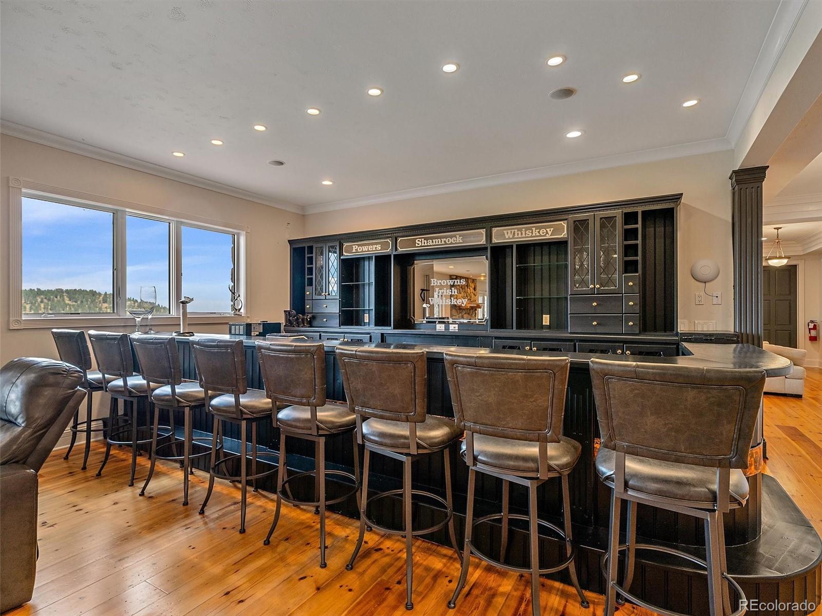 4213 Nambe Road Indian Hills, CO 80454 - Photo 37 of 49 a dinning room with stainless steel appliances granite countertop a table and chairs