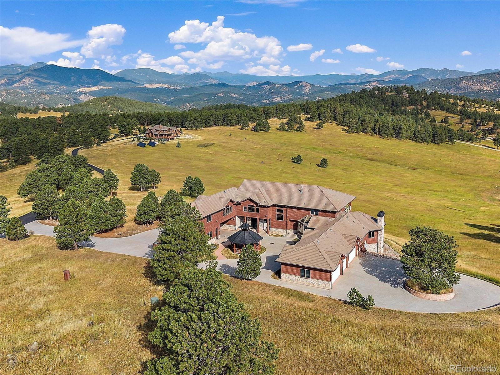 4213 Nambe Road Indian Hills, CO 80454 - Photo 4 of 49 a view of a city with an ocean
