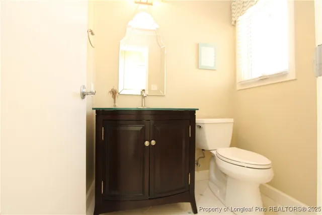 a kitchen with stainless steel appliances granite countertop a refrigerator a sink dishwasher and wooden cabinets