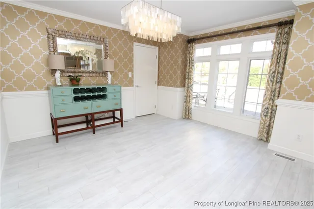 a view of a hallway with washer and dryer