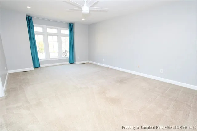 a white toilet sitting next to a bath tub