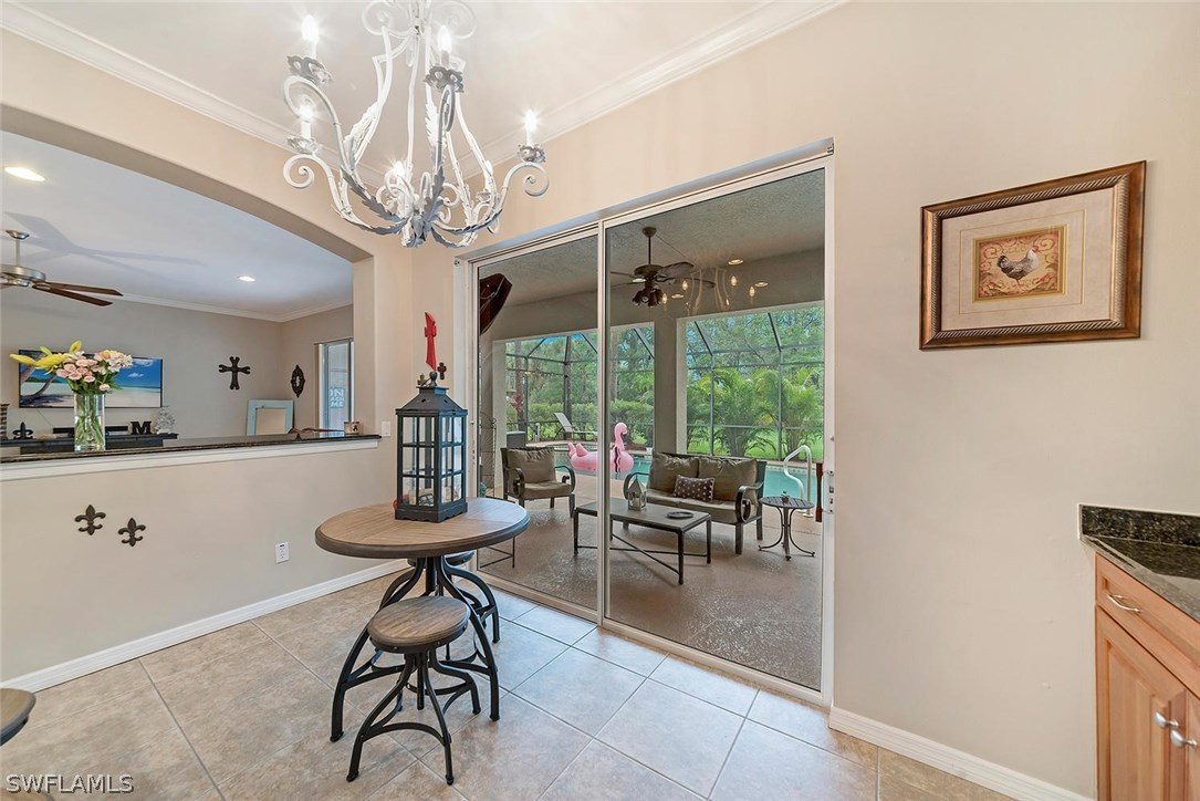 12941 Timber Ridge Drive Fort Myers, FL 33913 - Photo 13 of 30 a view of a dining room with furniture large windows and wooden floor