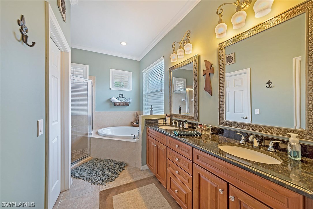 12941 Timber Ridge Drive Fort Myers, FL 33913 - Photo 17 of 30 a spacious bathroom with a sink double vanity granite tub and shower