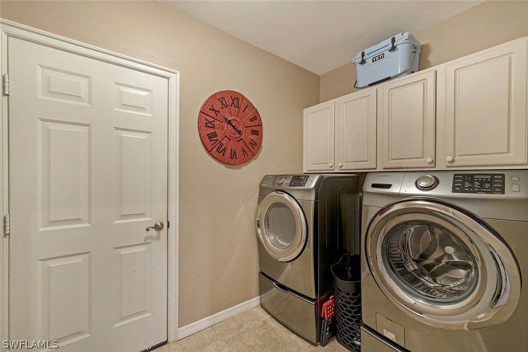 12941 Timber Ridge Drive Fort Myers, FL 33913 - Photo 21 of 30 a view of a storage and utility room with washer and dryer