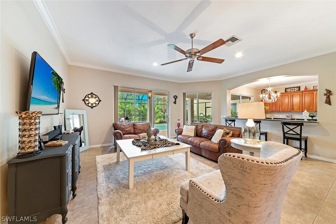 12941 Timber Ridge Drive Fort Myers, FL 33913 - Photo 3 of 30 a living room with fireplace furniture and a large window