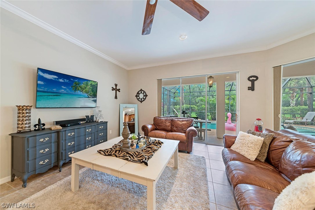 12941 Timber Ridge Drive Fort Myers, FL 33913 - Photo 4 of 30 a living room with furniture and a flat screen tv