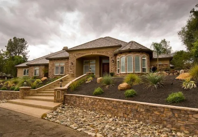 a front view of a house with a yard