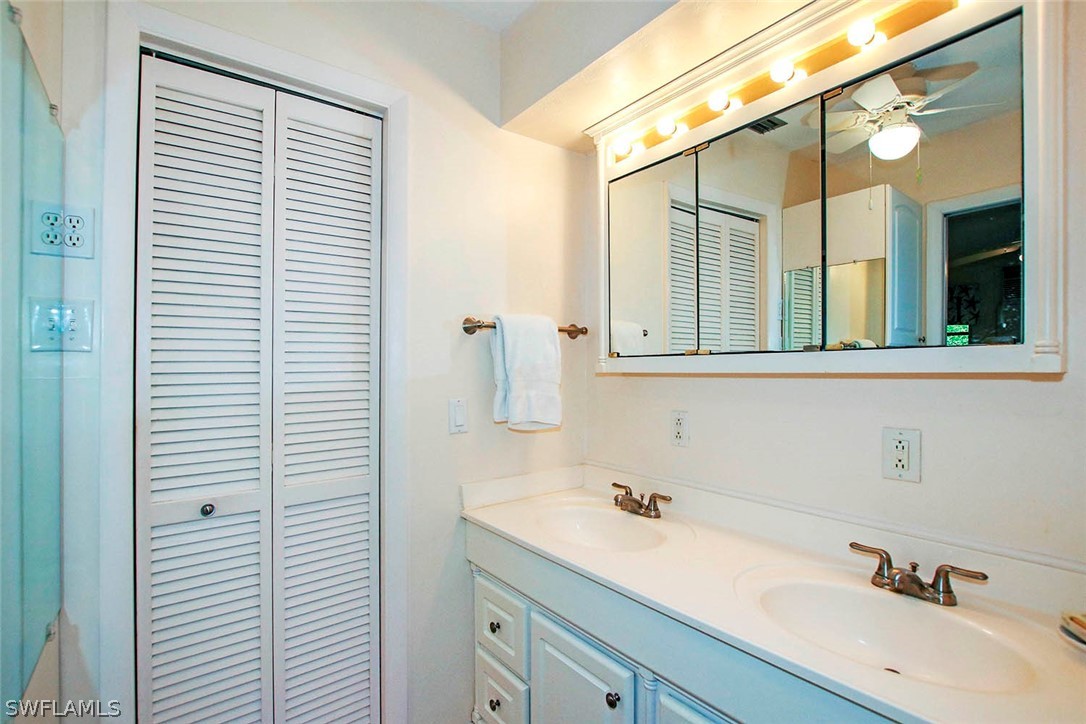 555 Rabbit Road Sanibel, FL 33957 - Photo 11 of 29 a bathroom with a sink and a mirror